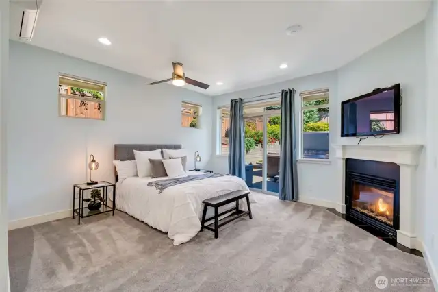 The main floor primary suite with gas fireplace for added comfort. Smart lighting, ductless head pump for personalized climate control and an HD plasma television.  And easy access to the hot tub!
