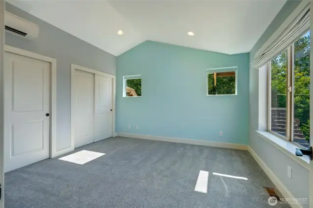 The large second bedroom with double closets faces south and has lovely light.  Vaulted ceilings, smart light switches and a ductless heat pump for customizable comfort.