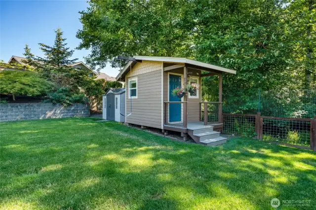 This small insulated room can function as a playhouse, guest room or a creative space!  It is fully wired for power and has a ceiling fan.