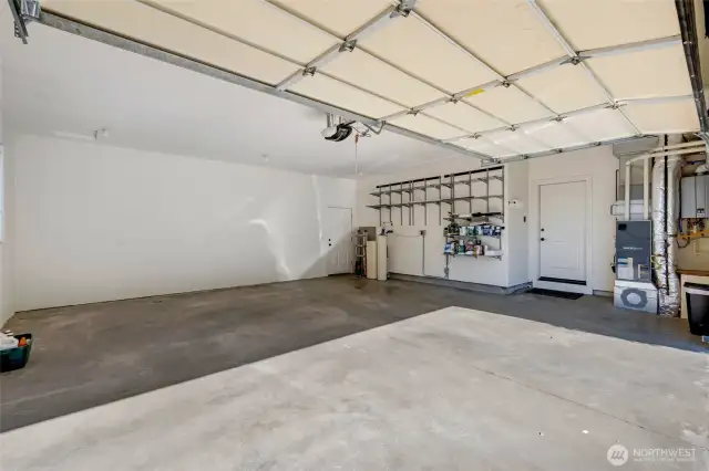 This is an extra large, insulated 2-car garage with plenty of room for storage or workspace.  A Tesla wall connector for car charging is included. The house is already plumbed for built in vacuum.