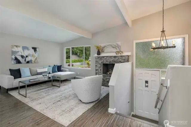 Living room features vaulted ceilings.