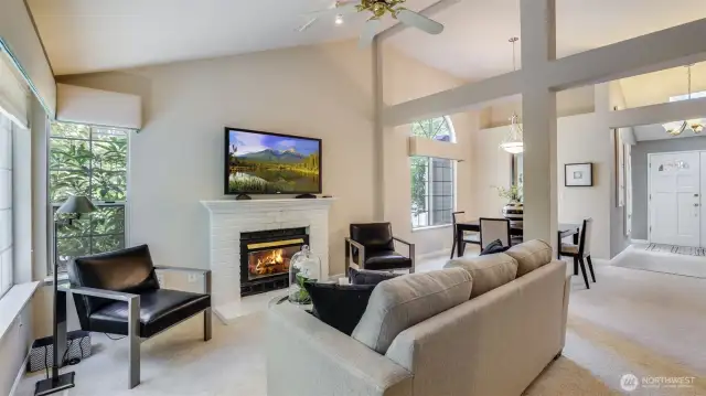 Standing next to the door that takes you outside you see the family room and the dining room.