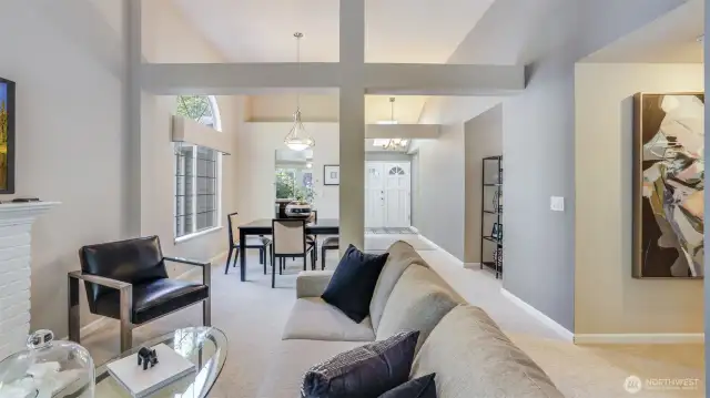 As you stand in the family room you see how open and airy the home feels with vaults and open design.