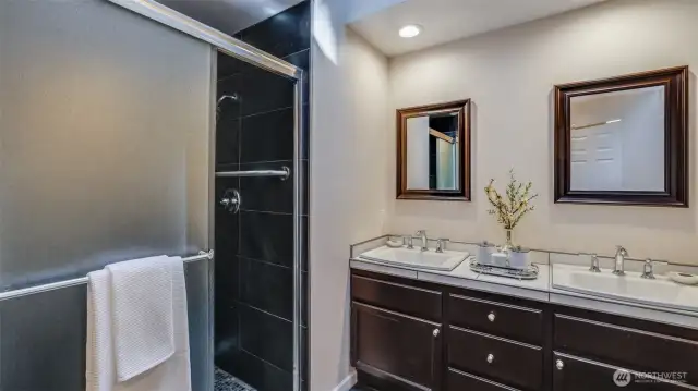 There is a large sunny skylight, large tile shower, beautiful tile flooring and gorgeous counters.