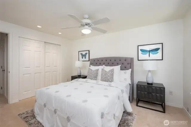 Primary bedroom with ceiling fan