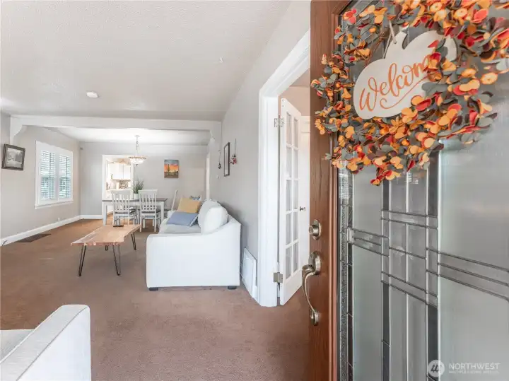 Bright living room with large windows bringing in abundant natural light
