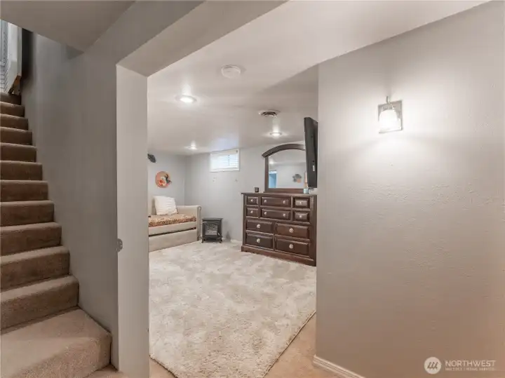 Stairs leading to fully finished lower level