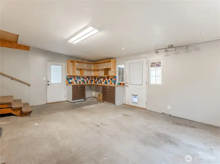 Enclosed patio ideal for workshop, gym, storage, or future sauna/cold plunge