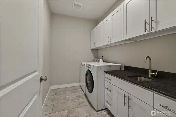 Laundry room with utility sink and great storage