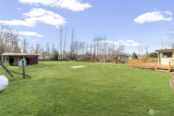 Riding lawnmower comes with the property! Grass has been enhanced on these back yard shots, though give it a month or so and it will look like this!