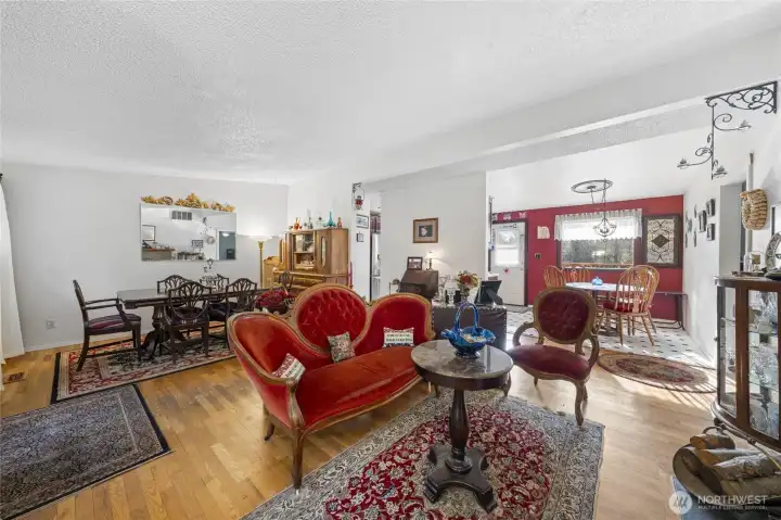 Lovely living room is nice and open to the dining room, dinette and kitchen