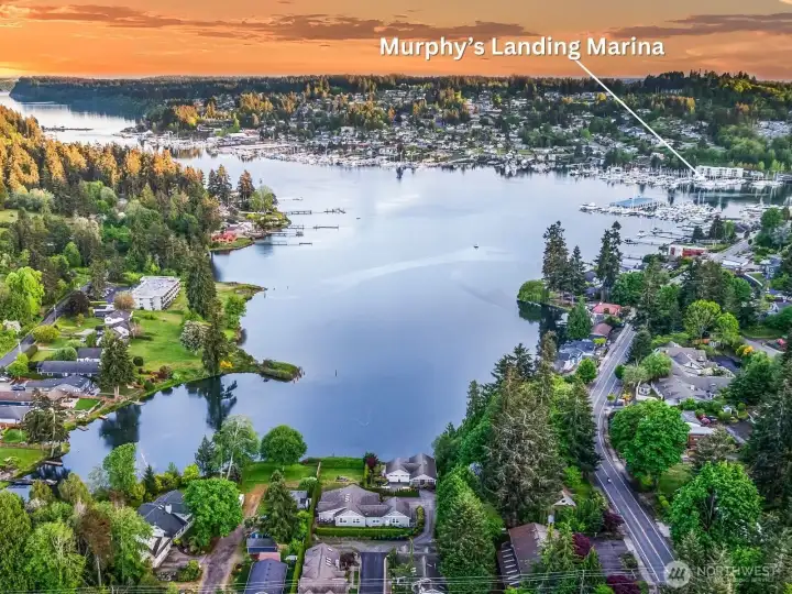 Aerial view facing south over downtown Gig Harbor — Murphy’s Landing Marina shown along the protected waterfront.