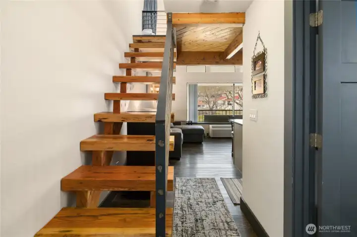 Hardwood stairs and modern metal railing--nice touch!