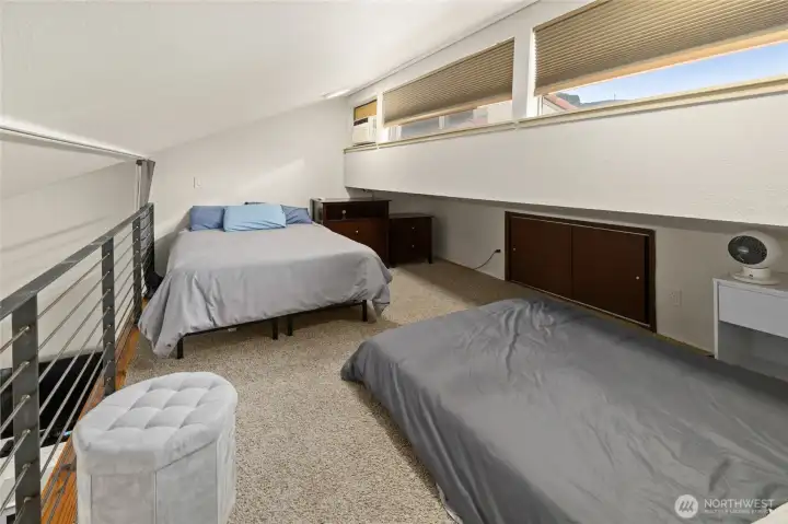 Upper loft area-light filled with two double beds!