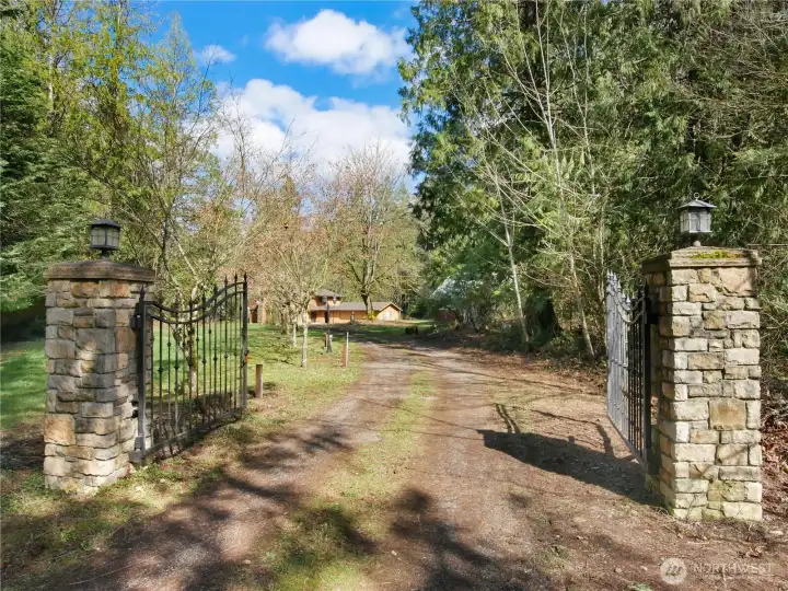 Step into a world of peace and privacy, where generous acreage offering a front-row seat to the ever-changing beauty of the seasons.