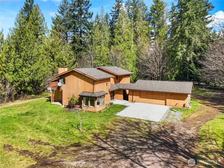 At the heart of this five-acre sanctuary sits a Pacific Northwest classic two-story residence with many new updates.
