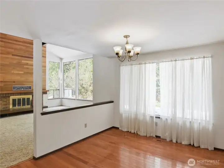 Living room leads directly adjacent to dining room, designed for entertaining and timeless holiday traditions that define a secluded country lifestyle.
