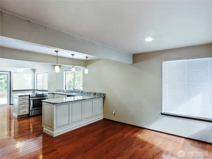 The joining family room designed to keep the conversation uninterrupted, creating a ideal vibrant gathering place.