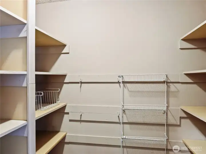 The well-placed walk-in pantry provides ample storage, making meal prep and kitchen organization a breeze."