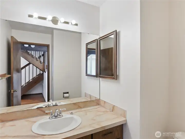 Convenient 1st floor Powder Room is wonderful for guest privacy and morning rush relief.