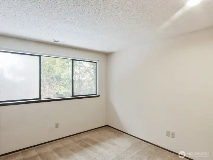 Large windows in the spacious upstairs bedrooms provide plenty of natural light and tranquil views of the landscape.