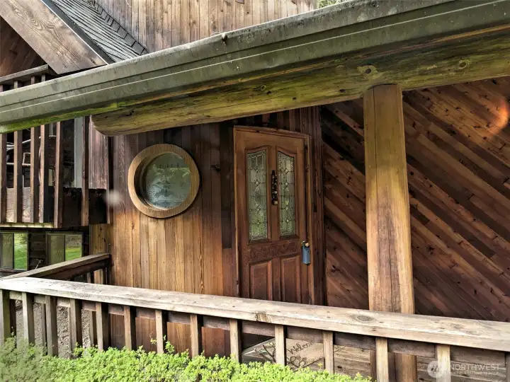 The front door, with a round porthole window!