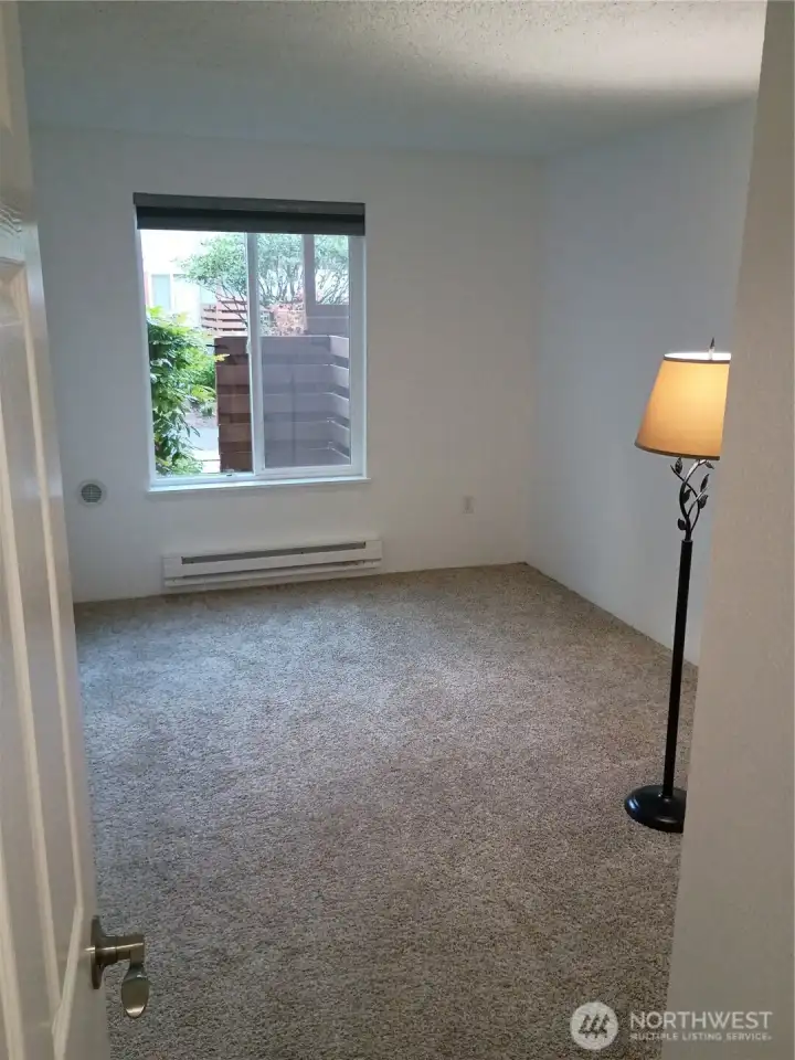 Bedroom 2 with new baseboard heat and 6 panel door
