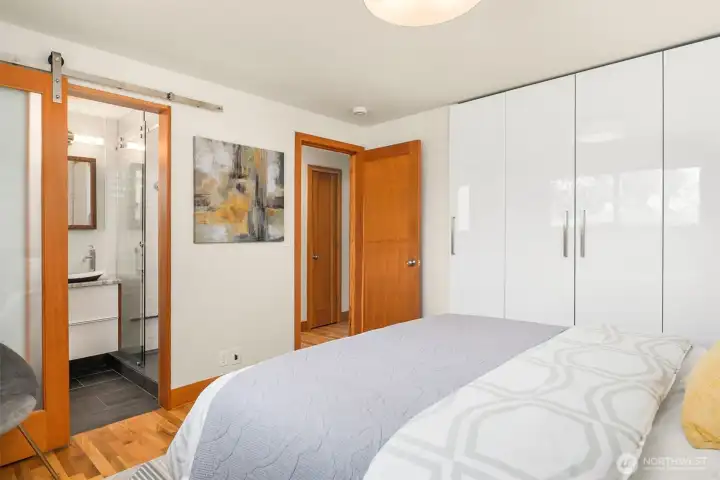 Primary bedroom, bathroom with custom closets Primary bedroom, bathroom with custom closets