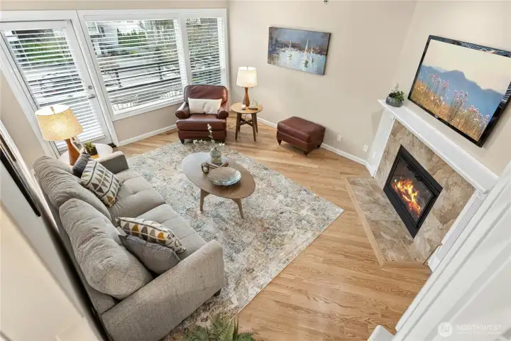 Here is another look at the living room with gleaming hardwood floors and a newer gas fireplace insert. Here is another look at the living room with gleaming hardwood floors and a newer gas fireplace insert.