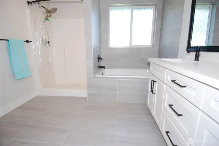 Full sized soaking tub in Primary bath