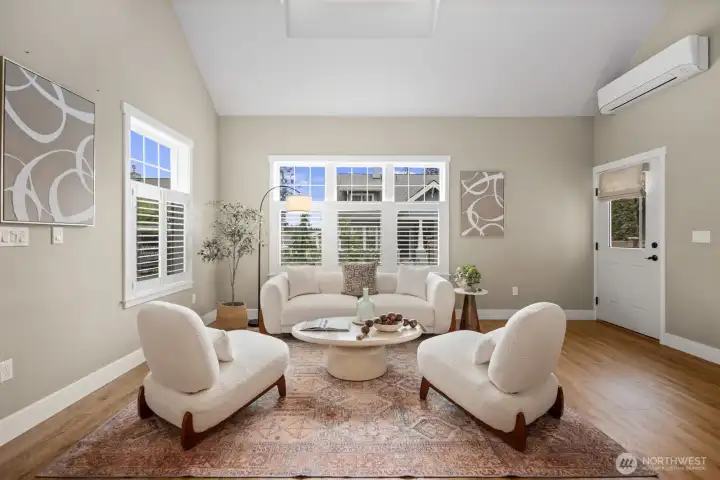 Open concept living room with so much natural light.