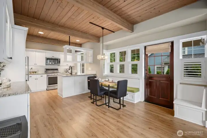 Kitchen with added luxury cabinets for extra storage and a built in seating area