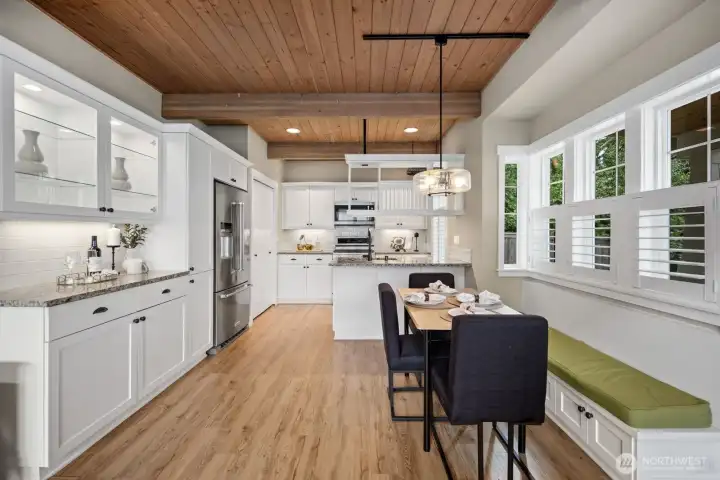 Kitchen with added luxury cabinets for extra storage and a built in seating area