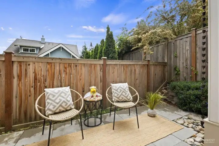 Backyard patio with plenty space for summer BBQ and relaxing.