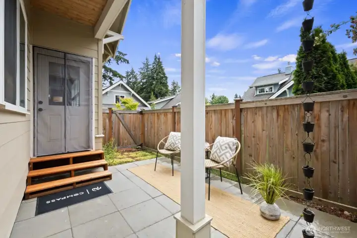 Backyard patio with plenty space for summer BBQ and relaxing.