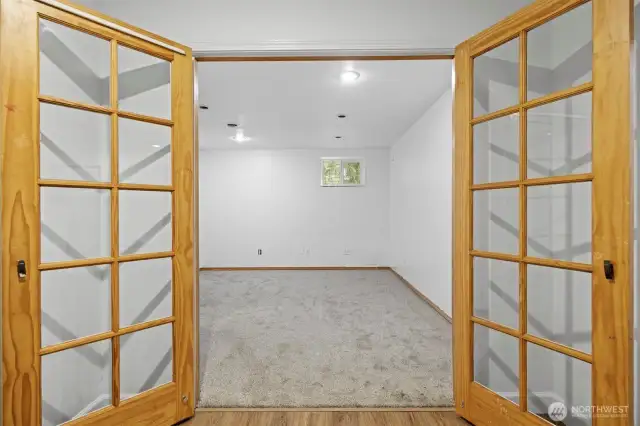French Doors into large Office/4th Bedroom, exercise room, you decide.