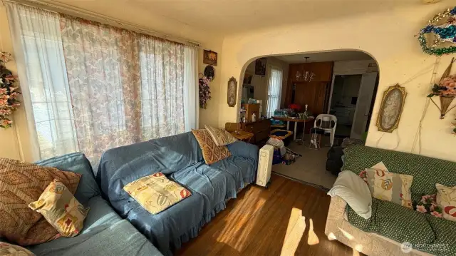Living room with adjoining dining room.