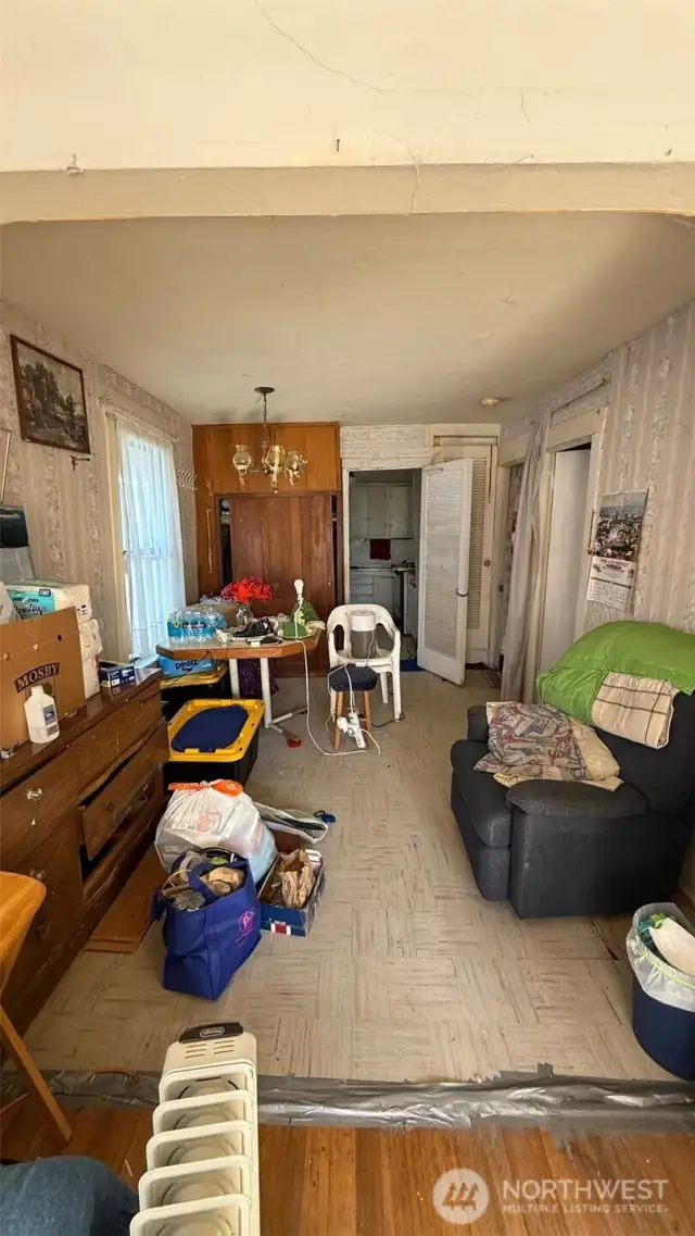 Dining room with adjoining kitchen.