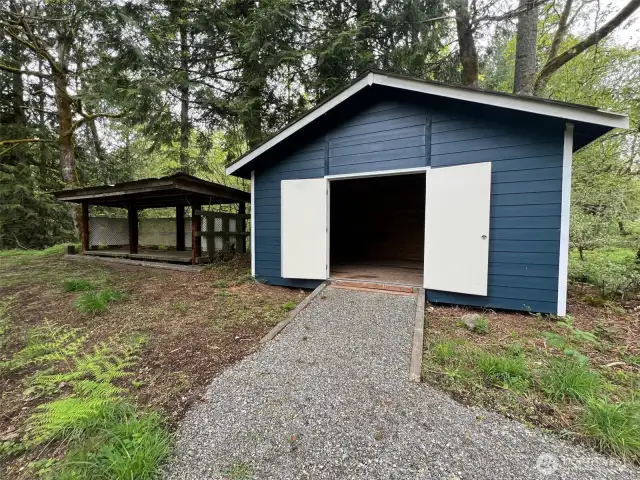 Nice newer 16 x 18 shop and wood shed.