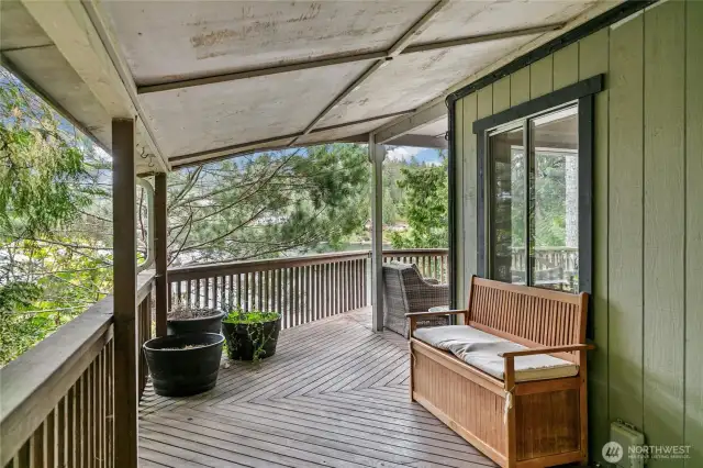 Enjoy the outdoors in any weather on the covered wraparound deck.