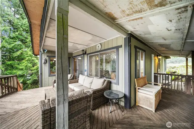 Full view of the expansive covered deck, an ideal bonus space for gatherings or peaceful mornings.