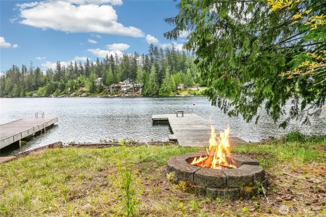A close-up of the dock and firepit area, perfect for gathering with guests and roasting marshmallows under the stars.