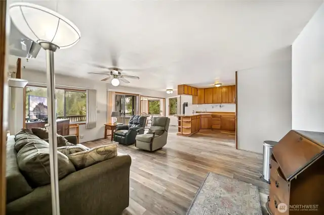 Step inside through the main entry into the living room, where vinyl plank flooring flows seamlessly throughout the cabin.