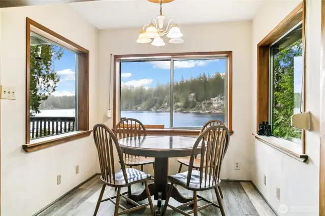 The dining area is surrounded by windows, providing amazing views of the lake as you dine.