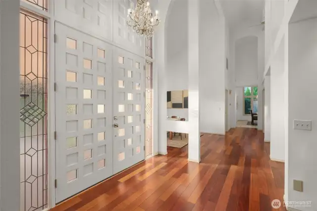 25 foot ceilings await you at this grand entrance to living space with new custom front door.