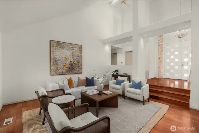 Formal sitting room off the entrance with rich hardwoods, vaulted ceilings and newer skylights.