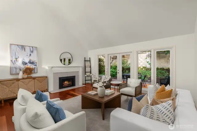 Living room features new gas fireplace, new dunn lumber windows and hardwoods.
