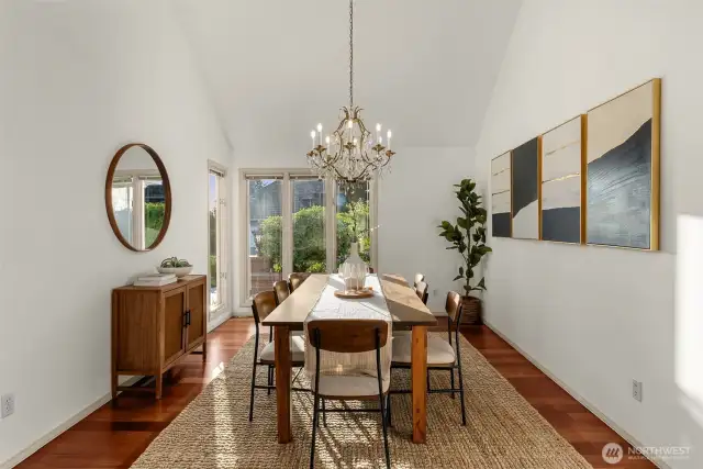 Formal dining room features hardwoods, vaulted ceilings.
