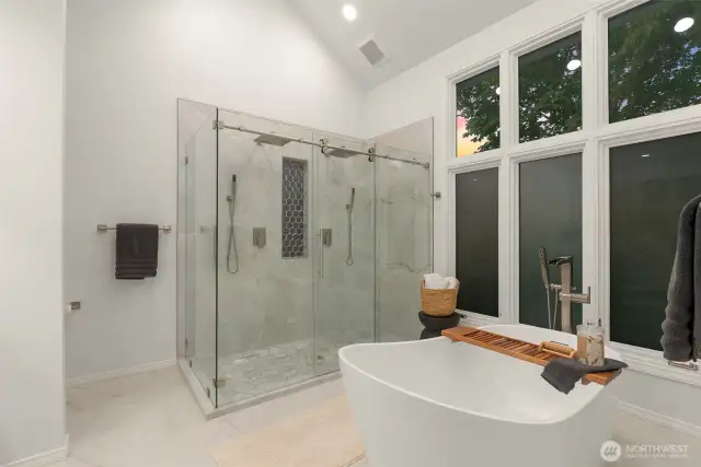 Primary ensuite fully remodeled in 2024 with free standing tub, ceramic shower, two sink vanity and new windows.