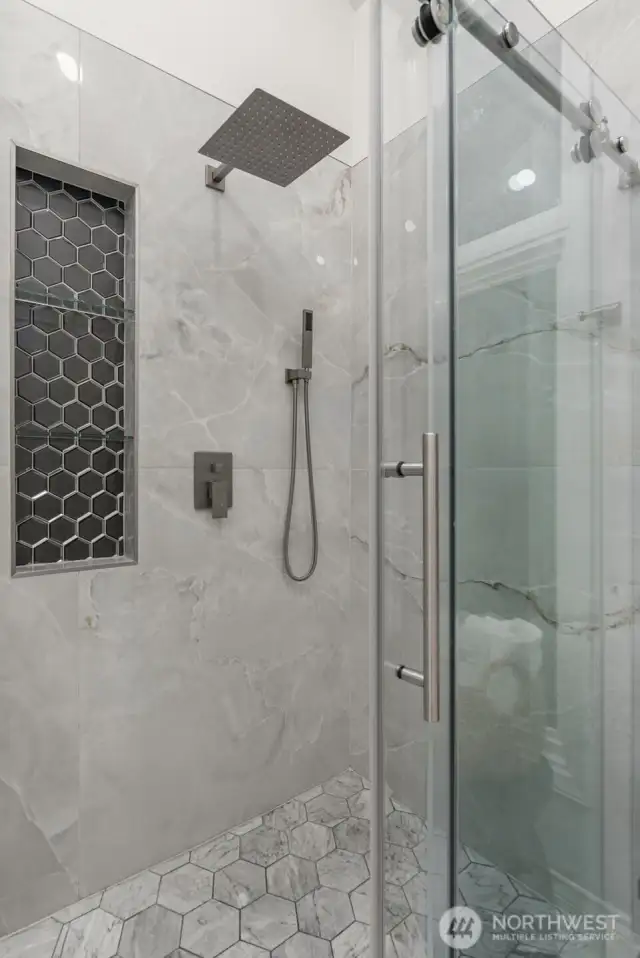 New shower with ceramic tile and custom floating glass door.